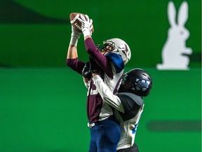 The Regina Thunder's Jh'Qhin Swan leaps to haul in a pass Saturday against the Winnipeg Rifles.