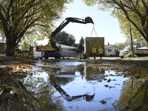 City of Regina crews worked to repair a water main break on Merlin Crescent in Regina on Friday.