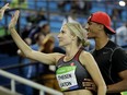 In this Aug. 13, 2016, file photo, Canada's Brianne Theisen-Eaton is greeted by husband Ashton Eaton, right, after the women's heptathlon 800-meter heat during the athletics competitions of the 2016 Summer Olympics at the Olympic stadium in Rio de Janeiro, Brazil. Two-time Olympic decathlon gold medalist Ashton Eaton and heptathlete Brianne Theisen-Eaton have announced their retirements, Wednesday, Jan. 4, 2017, in side-by-side essays on their website. Considered the first family of multi-events, the couple met at the University of Oregon as teenagers and married in July 2013.