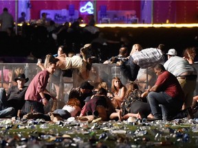 Reported Shooting At Mandalay Bay In Las Vegas

LAS VEGAS, NV - OCTOBER 01:  People scramble for shelter at the Route 91 Harvest country music festival after apparent gun fire was heard on October 1, 2017 in Las Vegas, Nevada. A gunman has opened fire on a music festival in Las Vegas, leaving at least 20 people dead and more than 100 injured. Police have confirmed that one suspect has been shot. The investigation is ongoing. (Photo by David Becker/Getty Images) ORG XMIT: 775052817
David Becker, Getty Images