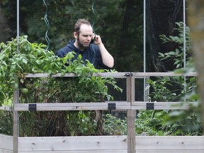Freed Canadian hostage Joshua Boyle talks on the phone outside the Boyle family home in Smiths Falls, Ontario, Canada, on October 14, 2017. MIKE CARROCCETTO, AFP/Getty Images
