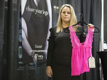 Kendra Strong-Garcia, Senior Director of Programs at YWCA Regina, holds up a piece of lingerie at the YWCA BLAME pop-up shop at the University of Regina.  It's controversial clothing display that's intended to oppose blaming and shaming victims of sex assault.