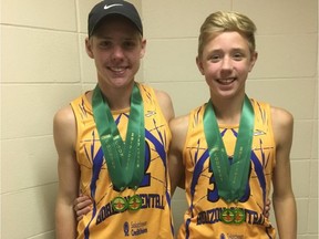 The Mytopher brothers —Brayden, left, and Adam — of Strasbourg's William Derby School pose with their gold medals from the Saskatchewan High Schools Athletic Association cross-country championships.