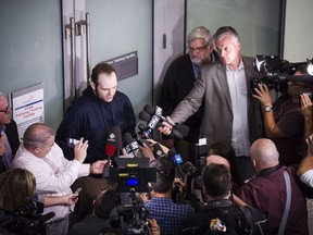 Joshua Boyle is photographed from above while he speaks to press after arriving at Lester B. Pearson Airport in Toronto on Friday, October 13, 2017. Boyle, His wife and and three children were held hostage for five years in Afghanistan. THE CANADIAN PRESS/Christopher Katsarov