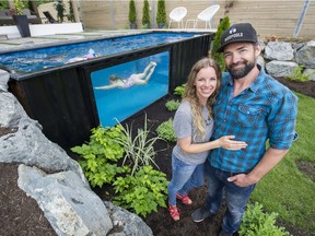 Paul Rathnam and his wife, Denise watch their three daughters, Savana, Sydney and Summer play in the Modpools, a shipping container converted into a pool/hot tub, in their backyard, Abbotsford, June 13 2017.