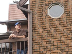 Corey Jackson stands on the balcony at a home in Regina's northwest. On Sept. 1, Corey was the victim of a home invasion and held against his will through the night.