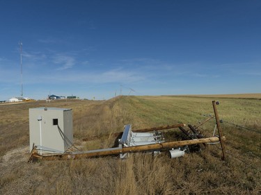 A power pole lays on its side, leaving the community of Leader without power on Wednesday morning. The area was evacuated Tuesday night from a wild fire and strong winds.