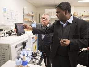 Dr. Mohan Babu tours Regina-Wascana MP Ralph Goodale through a lab at the University of Regina. Afterwards Goodale announced $3.7 million in funding for three U of R researchers.