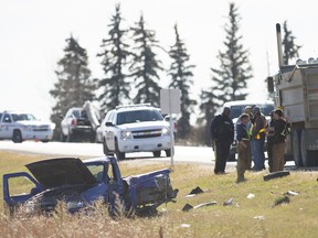 A truck and debris lay in the ditch at the scene of a collision on Pinkie Road.