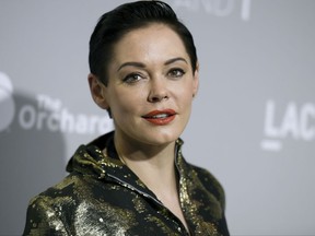 FILE - In this April 15, 2015 file photo, Rose McGowan arrives at the LA Premiere Of "DIOR & I" held at the Leo S. Bing Theatre on Wednesday, April 15, 2015, in Los Angeles. McGowan's Twitter account has been suspended, temporarily muting a central figure in the allegations against Harvey Weinstein. McGowan said late Wednesday, Oct. 11, 2017, that Twitter had suspended her from tweeting after the social media company said she broke its rules.(Photo by Richard Shotwell/Invision/AP)