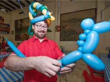Keegan Duck creates a horse out of a balloon during the Oktoberkinderfest event at the German Club.