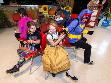 A group of participants play a game of "pass the pumpkin" during the Oktoberkinderfest event at the German Club.