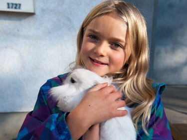 Emily Gaudet hold her Lionhead Rabbit "Snowball" during the Oktoberkinderfest event at the German Club. Gaudet proudly proclaimed that she had two more rabbits at home.