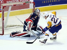 Braylon Shmyr of the Saskatoon Blades closes in on Regina Pats goalie Max Paddock on Wednesday night at the Brandt Centre.