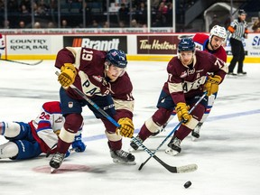 The Regina Pats' Jake Leschyshyn (left) and Matt Bradley try to break out against the Edmonton Oil Kings during Sunday's WHL game at the Brandt Centre.