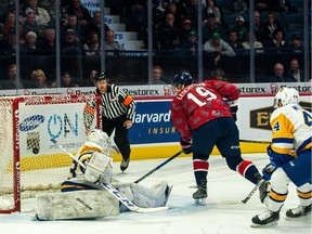 Regina Pats centre Jake Leschyshyn lifts the puck past Saskatoon Blades netminder Nolan Maier in WHL action at the Brandt Centre on Saturday.