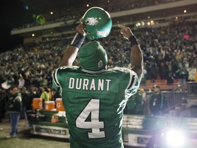 Darian Durant celebrates in 2009 after quarterbacking the Saskatchewan Roughriders to a first-place-clinching victory over the Calgary Stampeders.