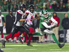 The Saskatchewan Roughriders' Duron Carter makes a diving catch for a 45-yard reception Friday against the visiting Ottawa Redblacks.