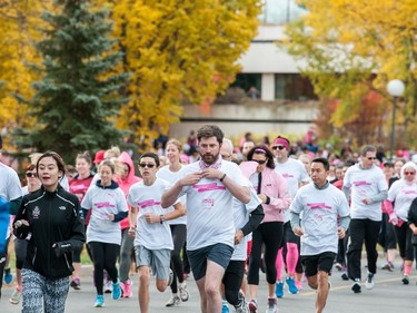 Participants in the CIBC Run For the Cure take off from the starting line near the TC Douglas building.