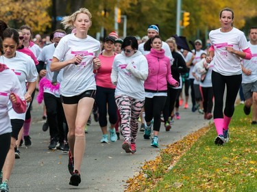 Participants in the CIBC Run For the Cure move along Hill Blvd.