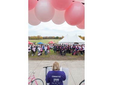 Participants in the CIBC Run For the Cure listen to the opening address before taking off down Memorial Way.