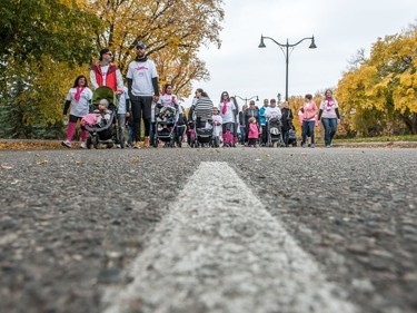 Participants in the CIBC Run For the Cure move along Hill Blvd.