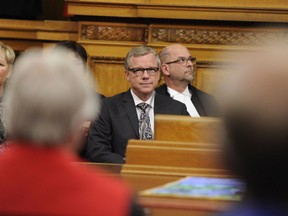 Saskatchewan Premier Brad Wall listens to the throne speech read Wednesday by Lieutenant-governor Vaughn Schofield.