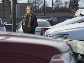Shayna Stock, executive director of the Heritage Community Association, stands in a parking lot near the corner of St. John Street and Saskatchewan Drive.