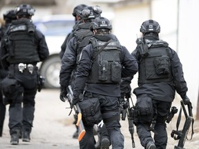 Members of the Regina Police Service and members of their SWAT team surrounded a home on the 1100 block of Elphinstone Street on Oct. 23, 2017.