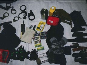 Bladed weapons, handcuffs and shackles found inside a Jeep driven by John Strang, after killing his wife Lisa in McLean, Sask. This is a copy of a photo placed on the court record. (Court of Queen's Bench photo)