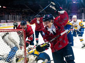 The Regina Pats' Emil Oksanen celebrates one of his two first-period goals on Saturday against the Saskatoon Blades at the Brandt Centre.