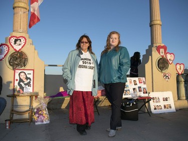 A missing persons candlelight vigil was held on the Albert Street Bridge in Regina.  Dianne Big Eagle,left, and Paula Bali both have missing daughters and took part in the event.
