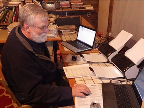 Peter von Stackelberg scans some of the 150,000 pages of documents that make up The Poison Papers. Photo courtesy Risa Scott/RF Scott imagery.