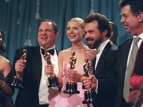 Harvey Weinstein, second from left, celebrates alongside the actress Gwynneth Paltrow and other producers of “Shakespeare in Love” after their film won the best picture Oscar, in Los Angeles, March 22, 1999.