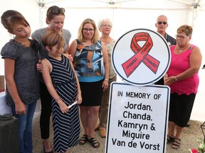 Family members unveil the first roadside memorial sign from the province honouring the Van de Vorst family at the site where the young family was killed by a drunk driver in January 2016.