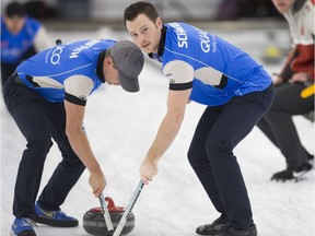 Regina's Catlin Schneider, right, and teammate Tyler Griffith, left, are ready for the Canadian Olympic team curling trials.