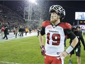 Calgary Stampeders quarterback Bo Levi Mitchell walks off the field after a 39-33 overtime loss to the Ottawa Redblacks in the 2016 Grey Cup game.
