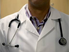 A doctor wears a stethoscope.