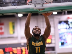 The University of Regina Cougars' Brian Ofori slams home two points Saturday against the visiting University of Lethbridge Pronghorns.