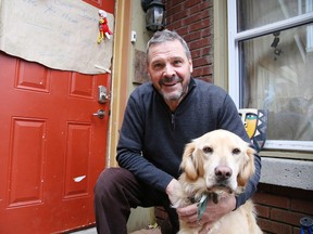 Dave Battaino with his daughter's dog Rosseau at his home in Sudbury, Ont. on Wednesday November 1, 2017. Battaino returned home to find a burglar in his home on Halloween night and helped police capture the individual.