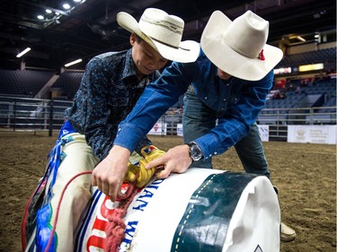 Justin Haffner of Bulyea gets a lesson in how to hold his rope at the Steer Riding Rodeo School during Agribition on Saturday, Nov. 25, 2017, at the Brandt Centre.