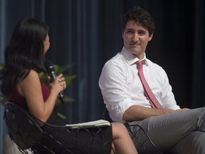 Journalist Lien Hoang questions Canadian Prime Minister Justin Trudeau during a Q&A session at the Ton Duc Thang University in Ho Chi Minh, Vietnam Thursday November 9, 2017.
