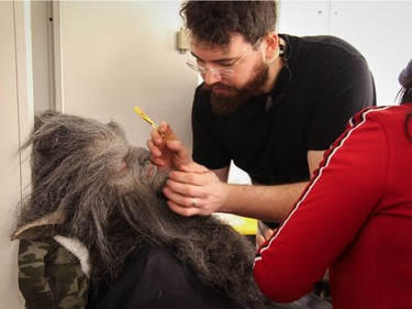 Emersen Ziffle (right) works on Leo Fafard's makeup on the set of Another WolfCop.