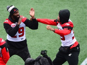 Calgary Stampeders' Jamar Wall, left, and Shaquille Richardson ham it up as they take part in the Grey Cup west division champions practice in Ottawa on Saturday, Nov. 25, 2017.