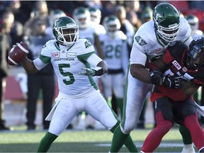 First-rate pass protection, such as that provided by Thaddeus Coleman, second from right, helped Roughriders quarterback Kevin Glenn, 5, enjoy time in the pocket on Sunday against the Ottawa Redblacks.