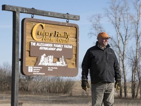 Grant Alexander  stands at the entrance to Horseshoe Creek Farms near Weyburn.