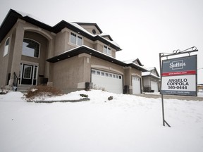 A for sale sign in front of a home in east Regina.