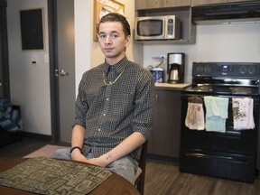 Jonathon Lacheur sits in his new suite at Gloria Jean's House, an affordable housing facility on west Dewdney Avenue.