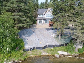 Cabin owner Dr. Stanley Riddell, 62, of Sammamish, WA, and his construction contractor, Jeffrey Dahl, 34, of Aspen Builders in Swan River, Man., recently pleaded guilty to altering the configuration of the bed, bank or boundary of Madge Lake, in Duck Mountain Provincial Park, contrary to the Environmental Management and Protection Act, and to unlawfully damaging trees and other natural vegetation on park land, contrary to The Park Regulations. Riddell was fined $12,600, with Dahl receiving a $9,800 fine. (photo submitted by Environment Ministry)
Submitted