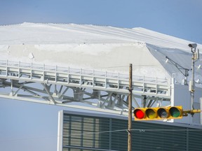 A snow cornice on the roof of Mosaic Stadium prompted the relocation of fans at Saturday's game. Snow still covered the roof on Monday.